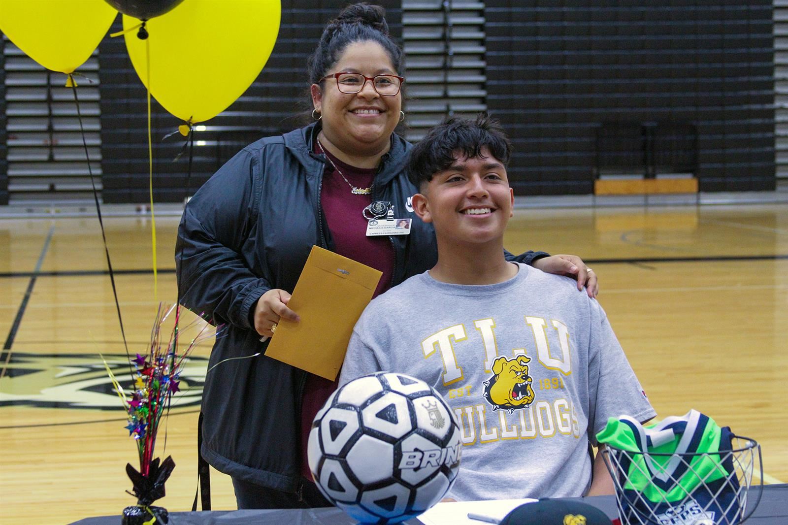 Cypress Park High School senior Jorge Ortega, seated, signed a letter of intent to play soccer at Texas Lutheran University. 